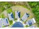 Aerial view of modern homes with solar panels in a well-maintained community surrounded by Florida foliage at 3161 Royal Tern Dr, Winter Haven, FL 33881