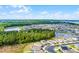 An elevated view showcases the house with its neighborhood, ponds, and surrounding greenery, creating an inviting community at 3161 Royal Tern Dr, Winter Haven, FL 33881