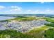 Wide aerial perspective captures the house within a large residential area, highlighting community amenities and proximity to parks at 3161 Royal Tern Dr, Winter Haven, FL 33881