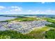 Wide aerial perspective captures the house within a large residential area, highlighting community amenities and proximity to parks at 3161 Royal Tern Dr, Winter Haven, FL 33881