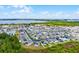 Extensive aerial shot of a community with various homes, ponds, and green spaces, showcasing a lively and well-planned neighborhood at 3161 Royal Tern Dr, Winter Haven, FL 33881