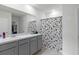 Functional bathroom features a double sink vanity, neutral tones, a shower with a curtain at 3161 Royal Tern Dr, Winter Haven, FL 33881
