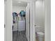 Walk-in closet offers shelving, storage, and easy access to the bathroom and bedroom at 3161 Royal Tern Dr, Winter Haven, FL 33881