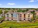 Beautiful aerial view of colorful townhomes, and manicured landscaping at 3344 Corona Village Way # 308, Orlando, FL 32835
