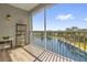 Inviting screened balcony with a lake view, perfect for relaxation at 3344 Corona Village Way # 308, Orlando, FL 32835