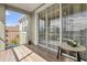 Cozy balcony with ample natural light coming through sliding glass doors at 3344 Corona Village Way # 308, Orlando, FL 32835