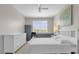 Bedroom with plenty of natural light, featuring a neutral color palette and comfortable furniture at 3344 Corona Village Way # 308, Orlando, FL 32835