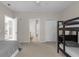 Bedroom features a bunk bed and ensuite bathroom with additional closet space at 3344 Corona Village Way # 308, Orlando, FL 32835