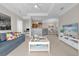 Bright living room with an open floor plan and a view into the kitchen at 3344 Corona Village Way # 308, Orlando, FL 32835