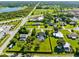 Scenic aerial view showcases homes with pools and lush landscapes in a suburban setting at 3820 Forest Cir, St Cloud, FL 34772