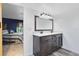 Bright bathroom featuring a double sink vanity with gray cabinets, white countertop and modern lighting fixtures at 3820 Forest Cir, St Cloud, FL 34772
