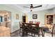Dining room with a tray ceiling and wooden furniture at 3820 Forest Cir, St Cloud, FL 34772