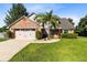 Charming two-story home with brick accents, well-manicured lawn, and inviting curb appeal in a desirable neighborhood at 3820 Forest Cir, St Cloud, FL 34772