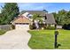 Charming two-story home with brick accents, a well-manicured lawn, and mature trees at 3820 Forest Cir, St Cloud, FL 34772