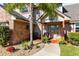 Inviting front porch with decorative details, complemented by lush landscaping and a cozy seating area at 3820 Forest Cir, St Cloud, FL 34772