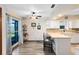 Eat-in kitchen boasts a breakfast bar, stainless appliances, and sliding doors at 3820 Forest Cir, St Cloud, FL 34772