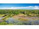 Stunning aerial view of estate with lake showcasing its serene natural surroundings and private location at 420 Ketch Rd, St Cloud, FL 34771