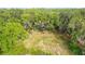 Beautiful aerial view of home nestled amongst lush surroundings with mature trees and lots of privacy at 420 Ketch Rd, St Cloud, FL 34771