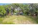 Aerial view of home showcasing the home's location amongst mature trees and expansive yard at 420 Ketch Rd, St Cloud, FL 34771