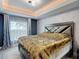 Bedroom with stylish wallpaper, a modern bed frame, and lots of natural light at 420 Ketch Rd, St Cloud, FL 34771