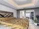 Spacious bedroom featuring a view of the closet with mirror doors, and modern furniture at 420 Ketch Rd, St Cloud, FL 34771