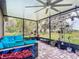 Enclosed patio with brick floors, outdoor seating, and a lovely view at 420 Ketch Rd, St Cloud, FL 34771