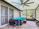 Screened in patio with outdoor seating and large ceiling fan at 420 Ketch Rd, St Cloud, FL 34771