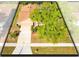 An aerial of the home showing the front yard, driveway, and landscaping at 4216 Gold Rush Ln, St Cloud, FL 34772