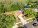 A charming single-Gathering home with a beautiful lawn, mature trees, and a screened-in pool for outdoor enjoyment at 4216 Gold Rush Ln, St Cloud, FL 34772