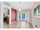 Elegant dining area with a chandelier, large bay window overlooking a pool, and easy access to the kitchen at 4216 Gold Rush Ln, St Cloud, FL 34772