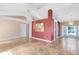 Open-concept living room with tiled floors, ceiling fan, and neutral paint, with an entryway on the left at 4216 Gold Rush Ln, St Cloud, FL 34772