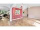 Spacious living room with tiled floors and a vaulted ceiling, showcasing an open-concept design at 4216 Gold Rush Ln, St Cloud, FL 34772