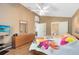 Bright main bedroom with wood floors, vaulted ceiling and ensuite bathroom access at 4216 Gold Rush Ln, St Cloud, FL 34772