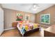 Spacious main bedroom with vaulted ceiling, wood floors, and bright windows at 4216 Gold Rush Ln, St Cloud, FL 34772