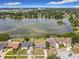 Breathtaking aerial view showcasing a serene lake, surrounded by lush greenery and residential homes at 4343 Lake Richmond Dr, Orlando, FL 32811