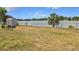 View of a fenced backyard and lake beyond at 4343 Lake Richmond Dr, Orlando, FL 32811