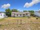The property features a spacious, fenced backyard, offering privacy and ample room for outdoor activities at 4343 Lake Richmond Dr, Orlando, FL 32811