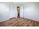 This is a bedroom with wood floors, closet and a bathroom nearby at 4343 Lake Richmond Dr, Orlando, FL 32811