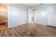Comfortable bedroom features wood-look floors, a connecting bathroom, and a double door closet at 4343 Lake Richmond Dr, Orlando, FL 32811