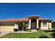 Beautiful single-story home featuring a barrel tile roof and a well-manicured lawn at 448 Cinnamon Dr, Kissimmee, FL 34759