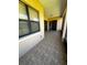 Enclosed patio featuring tile flooring and neutral paint at 448 Cinnamon Dr, Kissimmee, FL 34759