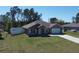 Inviting single-Gathering home boasts a well-kept lawn, fenced yard, and an attached two-car garage at 4490 Sw 169Th Pl, Ocala, FL 34473
