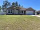 Charming single-story home with well-manicured lawn, attached garage, and inviting front entrance at 4490 Sw 169Th Pl, Ocala, FL 34473