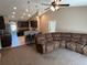 Open concept living space featuring a sectional sofa that blends to the kitchen at 4490 Sw 169Th Pl, Ocala, FL 34473