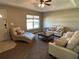 Cozy living room featuring neutral tones, plush seating, and abundant natural light from the window at 4490 Sw 169Th Pl, Ocala, FL 34473