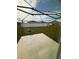 This backyard features a concrete patio, grill, grass, and white fences at 4812 Worchester Dr, Kissimmee, FL 34746