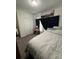 This bedroom features plush carpeting, double door closet, and a decorative art piece at 4812 Worchester Dr, Kissimmee, FL 34746