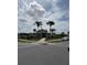 Charming community center features a welcoming entrance, sidewalks and tropical landscaping and convenient parking at 4812 Worchester Dr, Kissimmee, FL 34746