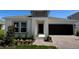 Charming single-story home with a dark garage door, neutral paint, and a well-manicured lawn at 4812 Worchester Dr, Kissimmee, FL 34746
