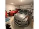 This spacious garage has two cars parked inside with a functional garage door at 4812 Worchester Dr, Kissimmee, FL 34746